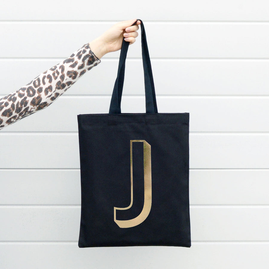 SECONDS - Initial black with gold foil Tote Bag